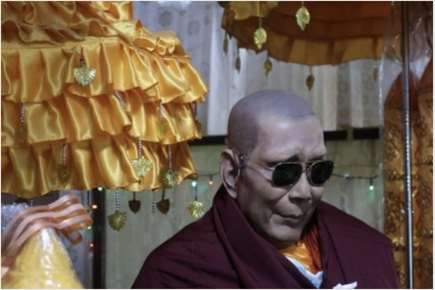 A photo of a wax sculpture of a monk in Penang, Malaysia, by Thomas Nathan Patton.
